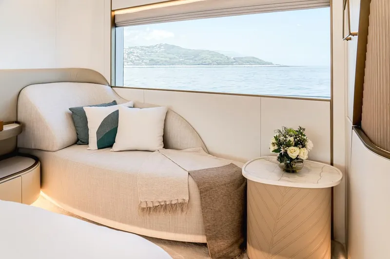 Slide: The Image of Luxurious interior of 2025 Majesty 100 Terrace yacht with elegant seating and ocean view. - 30