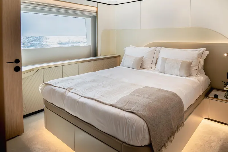 Slide: The Image of Luxurious bedroom interior on Majesty 100 Terrace yacht, 2025 model, with ocean view window. - 34