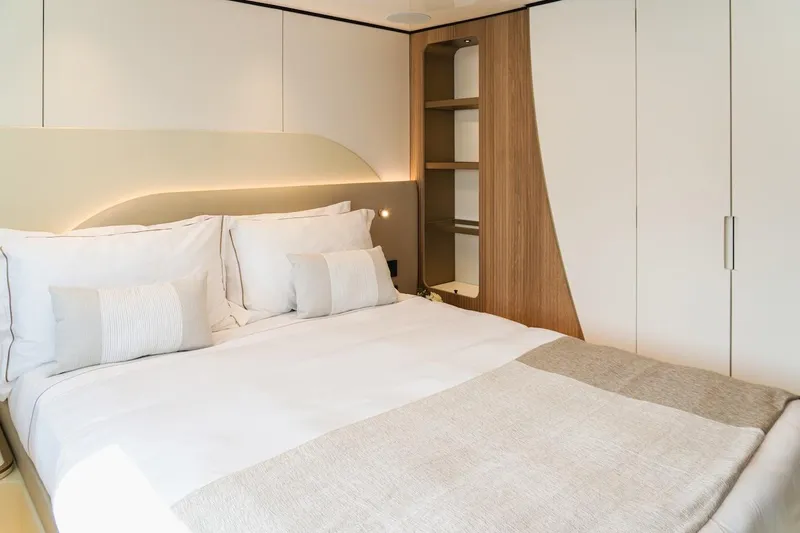 Slide: The Image of Luxurious bedroom interior in 2025 Majesty 100 Terrace yacht, featuring modern design and cozy bedding. - 35