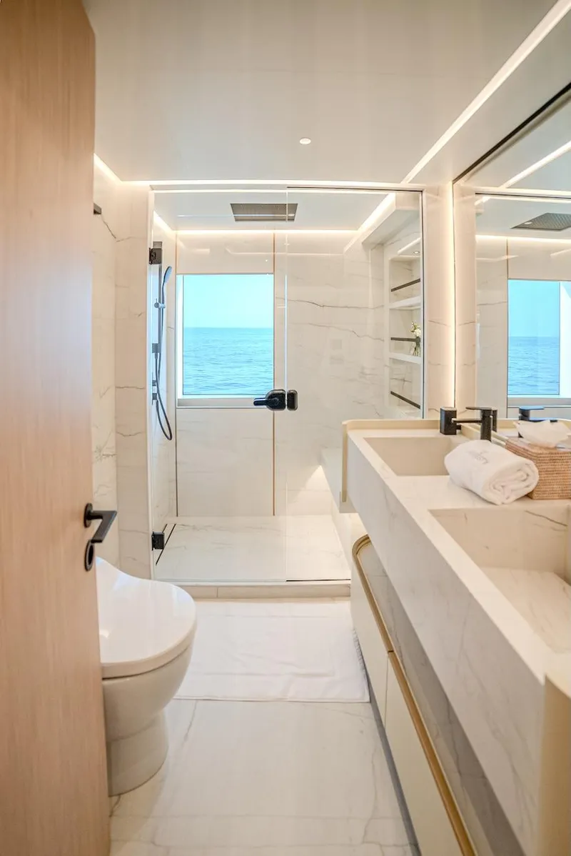 Slide: The Image of Luxurious bathroom on Majesty 100 Terrace yacht, 2025 model, featuring modern fixtures and ocean view. - 39