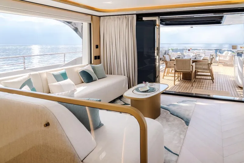Slide: The Image of Luxurious interior of 2025 Majesty 100 Terrace yacht with ocean view and elegant seating. - 42