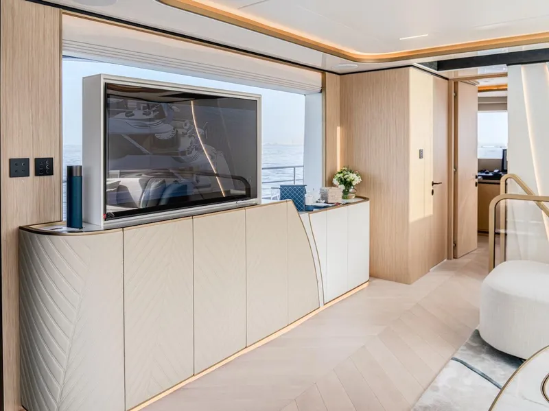 Slide: The Image of Luxurious interior of 2025 Majesty 100 Terrace yacht with modern decor and large TV. - 46