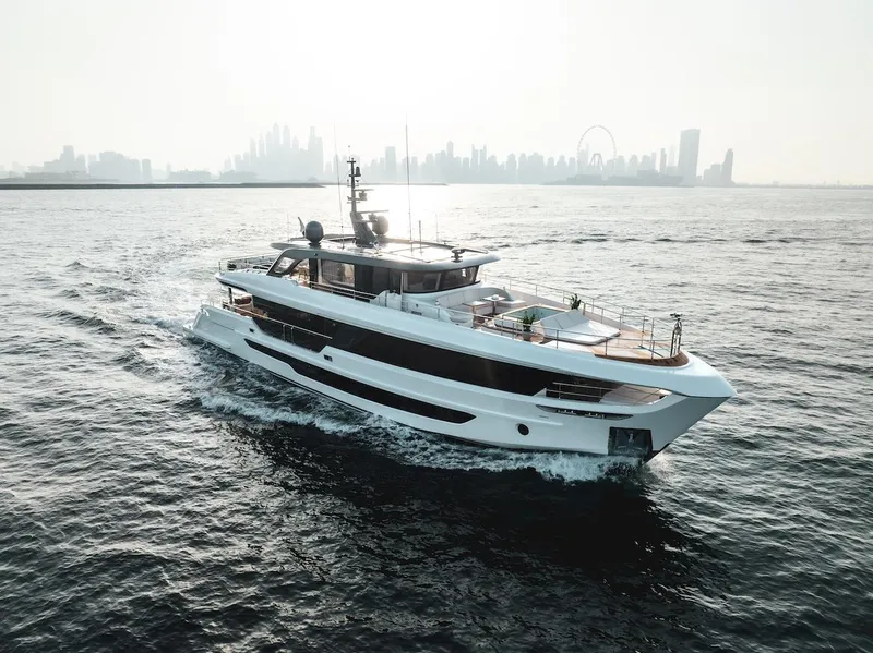 Slide: The Image of Majesty 100 Terrace yacht cruising with city skyline in background, 2025 model. - 7