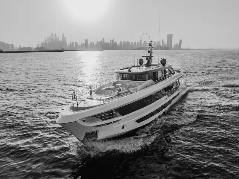 Slide: The Image of Majesty 100 Terrace yacht cruising with city skyline backdrop, 2025 model. - 8