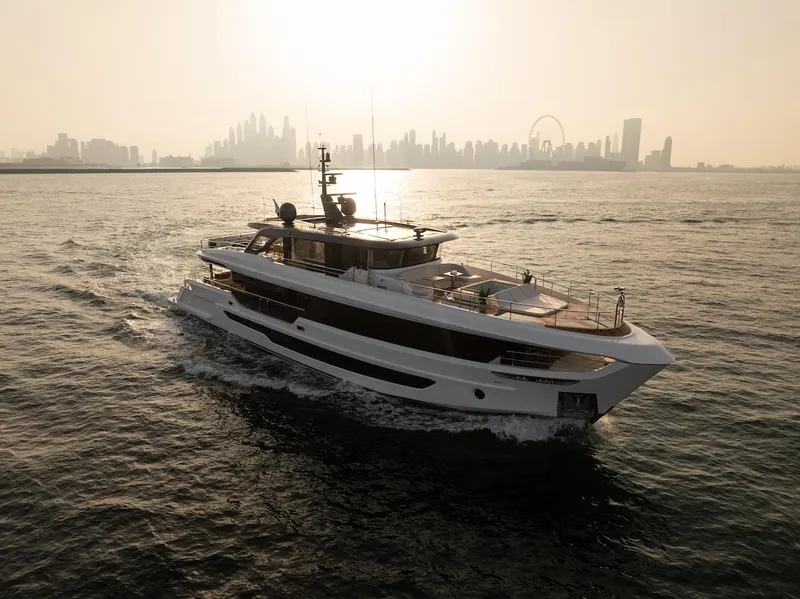 Slide: The Image of Majesty 100 Terrace yacht cruising with city skyline backdrop, 2025 model. - 9