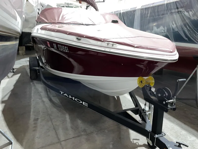 The Image of 2021 Tahoe 550 TS boat on trailer in storage facility. - 0