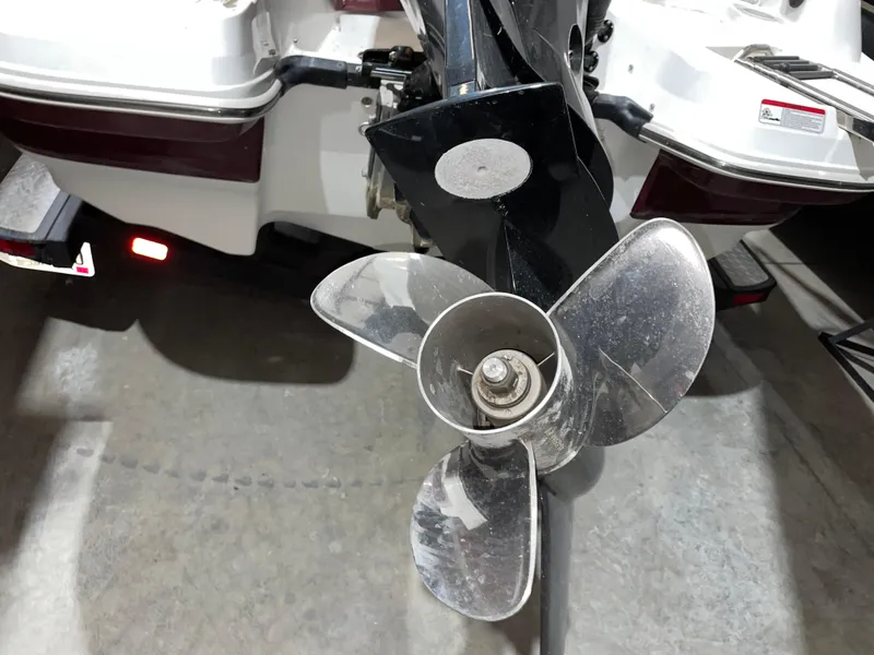 Slide: The Image of 2021 Tahoe 550 TS boat propeller, close-up view in a garage setting. - 8