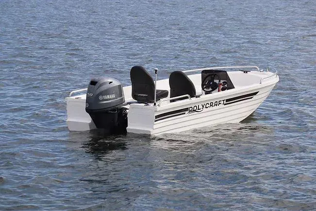 Slide: The Image of 2021 Polycraft 410 Challenger Side Console boat on water with Yamaha engine. - 2