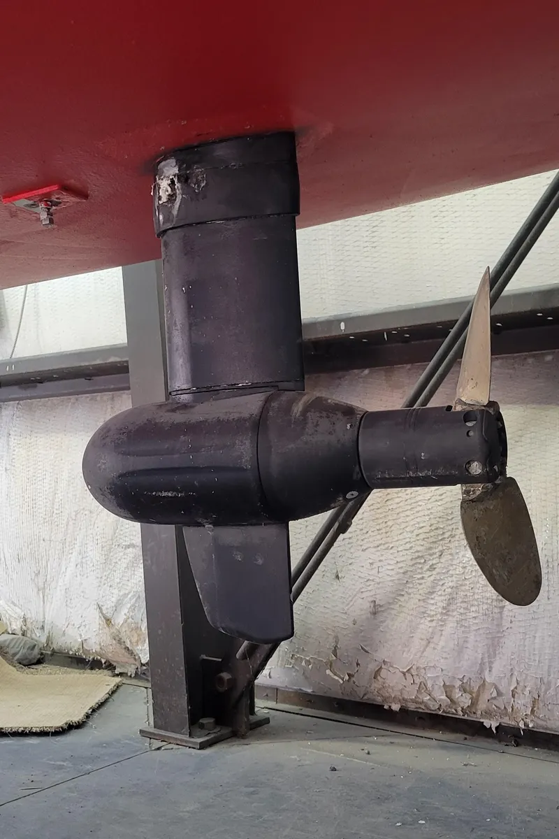 Slide: The Image of 2023 C.W. Hood 32 Daysailer propeller and rudder detail in a workshop setting. - 6