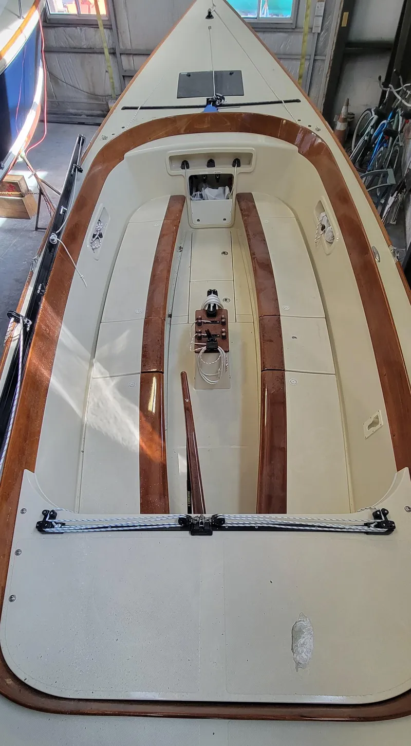 Slide: The Image of 2023 C.W. Hood 32 Daysailer with sleek wooden accents and spacious cockpit design. - 8