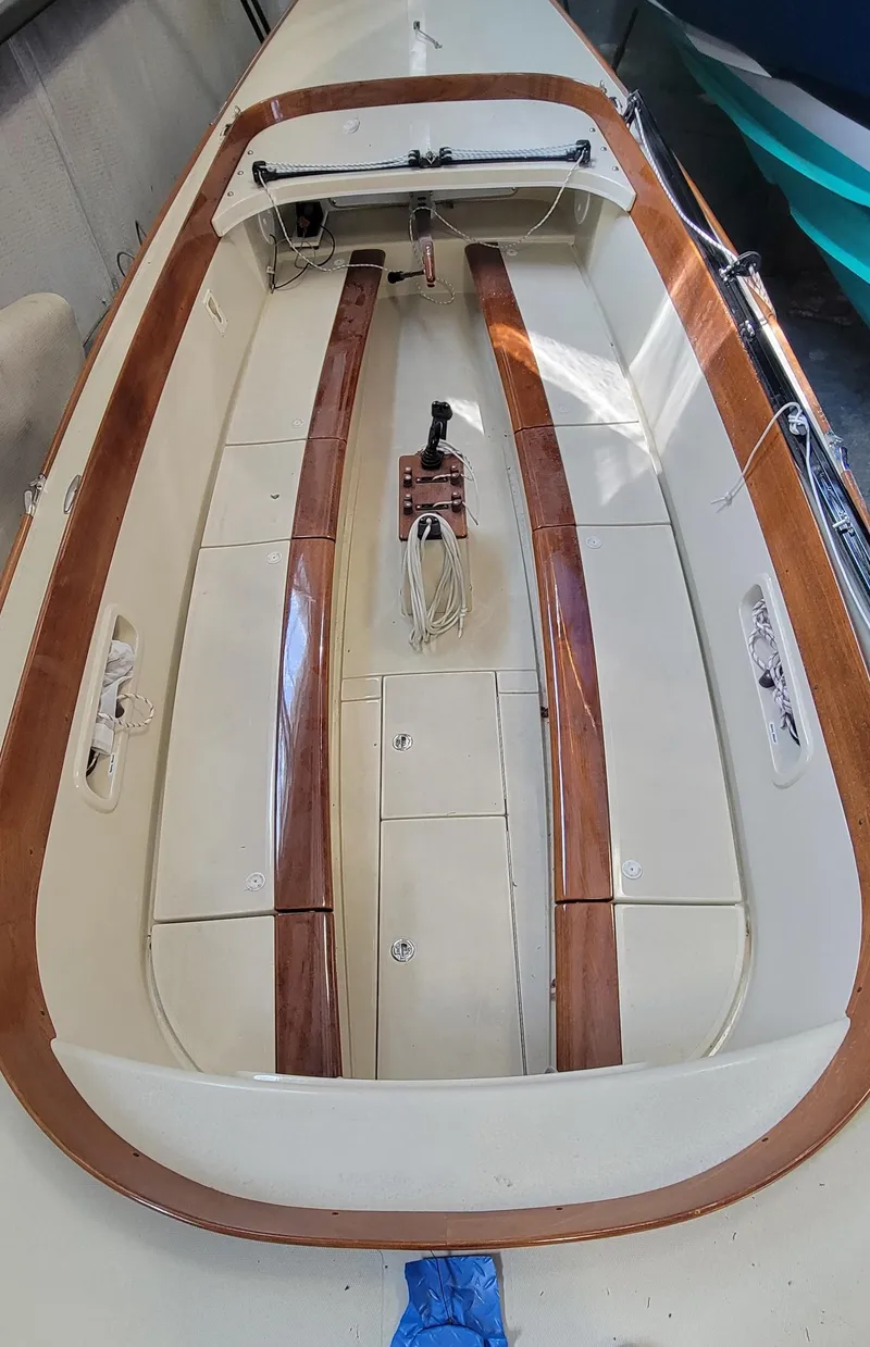 Slide: The Image of 2023 C.W. Hood 32 Daysailer interior with wooden accents and sleek design. - 9