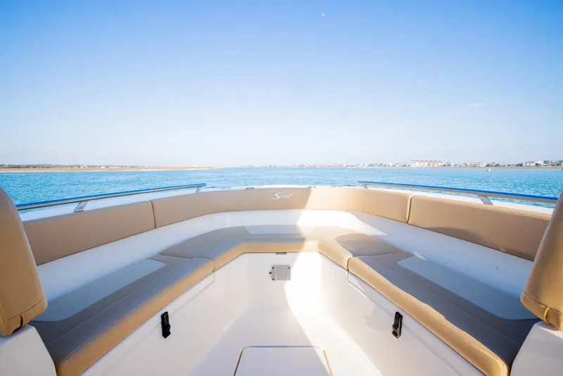 Slide: The Image of 2021 Scout 277 LXF boat interior with ocean view and comfortable seating. - 45