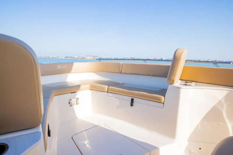 Slide: The Image of 2021 Scout 277 LXF boat interior with beige seating, ocean view. - 46