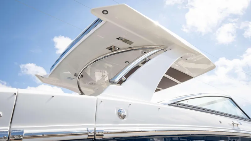 Slide: The Image of 2025 Cobalt R33 boat with sleek design and modern features under a clear blue sky. - 10