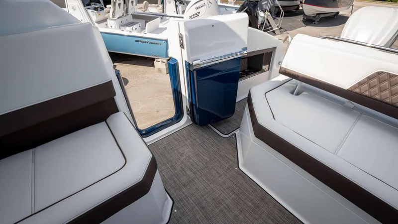Slide: The Image of Interior of 2025 Cobalt R33 boat with white and brown seating. - 18