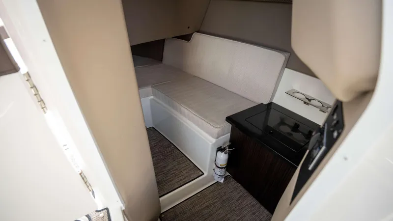 Slide: The Image of 2025 Cobalt R33 cabin interior with seating and storage area. - 49