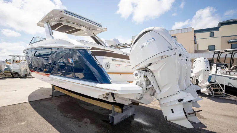Slide: The Image of 2025 Cobalt R33 boat with Yamaha engines, displayed outdoors on a sunny day. - 6