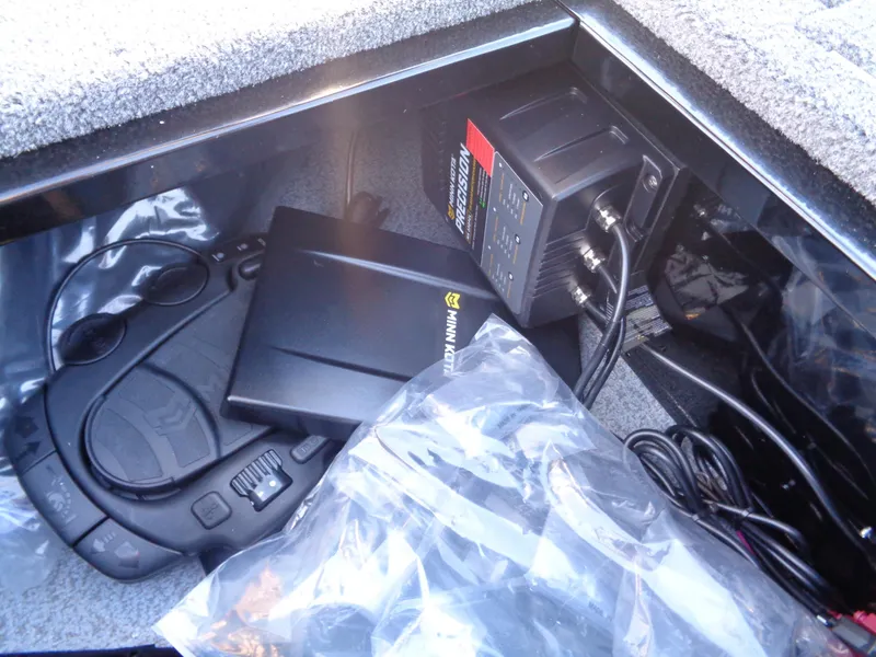 Slide: The Image of Storage compartment in 2025 Lund 1650 Angler SS boat with electronic equipment. - 11