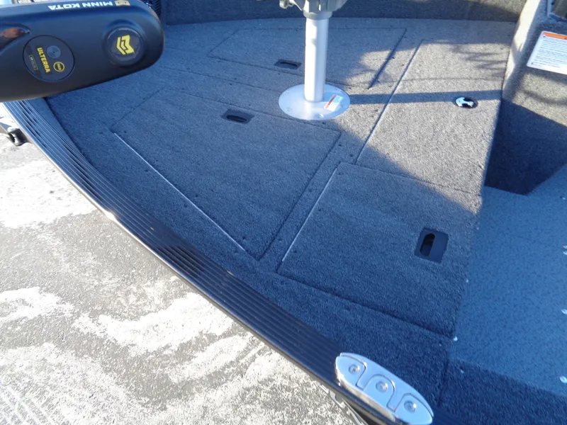 Slide: The Image of 2025 Lund 1650 Angler SS boat deck with storage compartments and seat base. - 12