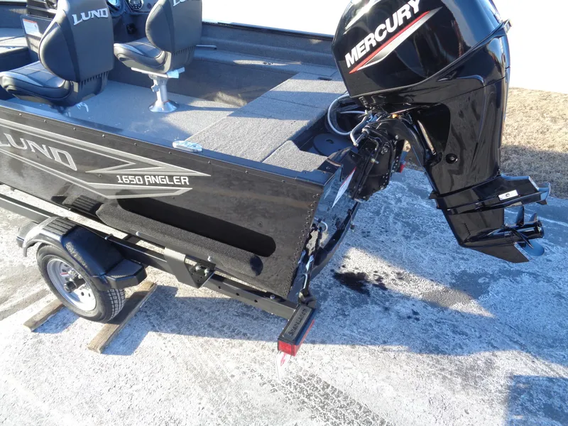 Slide: The Image of 2025 Lund 1650 Angler SS boat with Mercury outboard motor on trailer. - 4