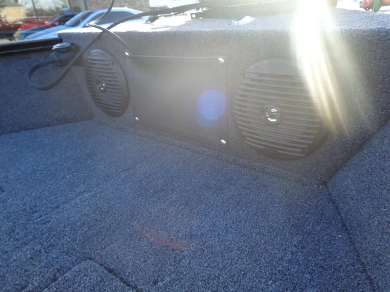 Slide: The Image of 2025 Lund 1650 Angler SS boat interior with speakers and sunlight. - 8