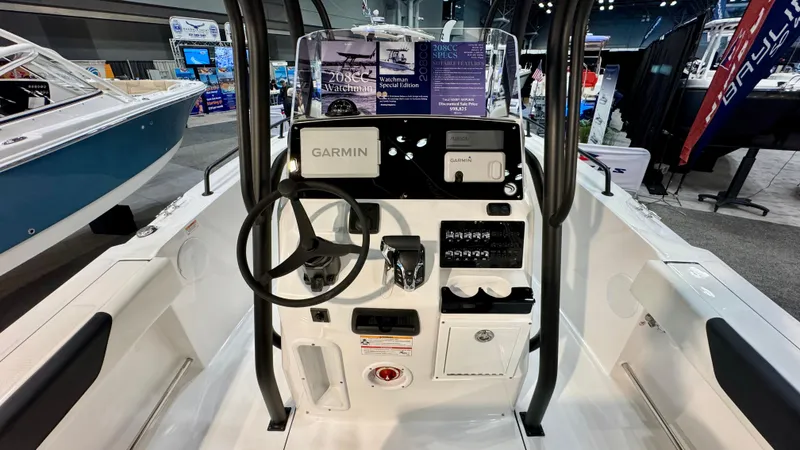 Slide: The Image of 2025 Edgewater 208CC Watchman boat console with Garmin navigation system at a boat show. - 4
