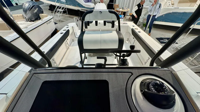 Slide: The Image of 2025 Edgewater 208CC Watchman boat interior with modern console and seating. - 5