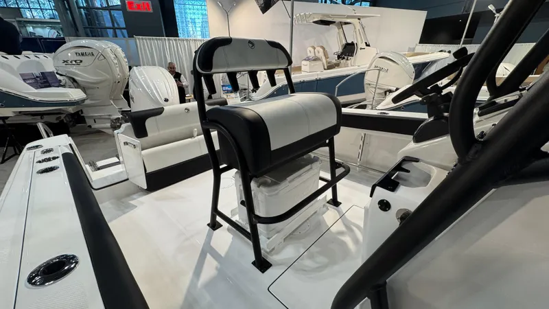 Slide: The Image of 2025 Edgewater 208CC Watchman boat interior with seating and controls. - 6