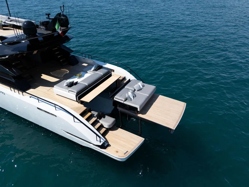 Slide: The Image of Luxurious 2026 AB 110 yacht with spacious deck and elegant seating on calm blue waters. - 4