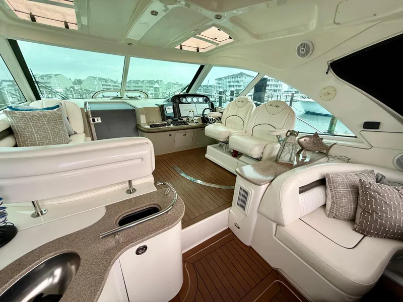 Slide: The Image of Luxurious interior of a 2006 Sea Ray 48 Sundancer yacht with plush seating and modern amenities. - 16