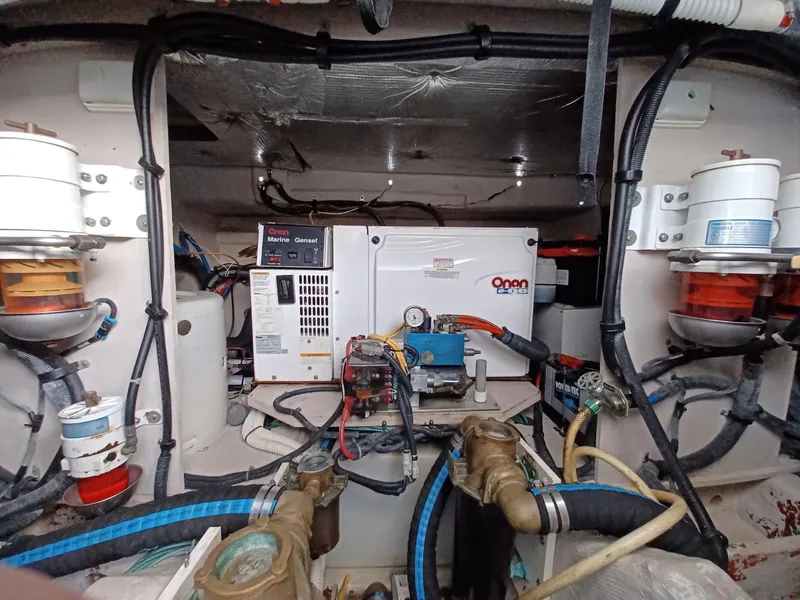 Slide: The Image of Engine room of 2006 Sea Ray 48 Sundancer with Onan generator and wiring. - 19