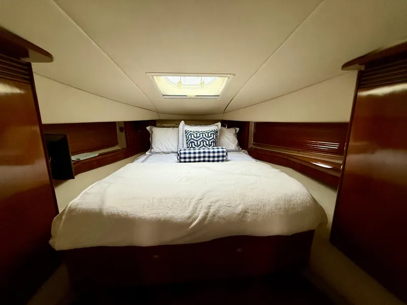 Slide: The Image of Luxurious cabin interior of 2006 Sea Ray 48 Sundancer yacht with cozy bedding. - 20