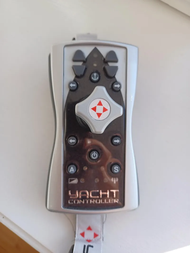 Slide: The Image of Remote control for 2006 Sea Ray 48 Sundancer yacht, featuring navigation and control buttons. - 27