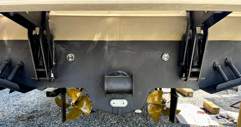 Slide: The Image of 2006 Sea Ray 48 Sundancer boat stern with propellers and trim tabs visible. - 29