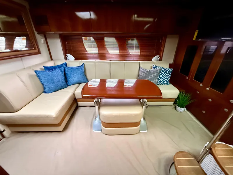 Slide: The Image of Luxurious interior of 2006 Sea Ray 48 Sundancer yacht with elegant wood finishes and cozy seating. - 3