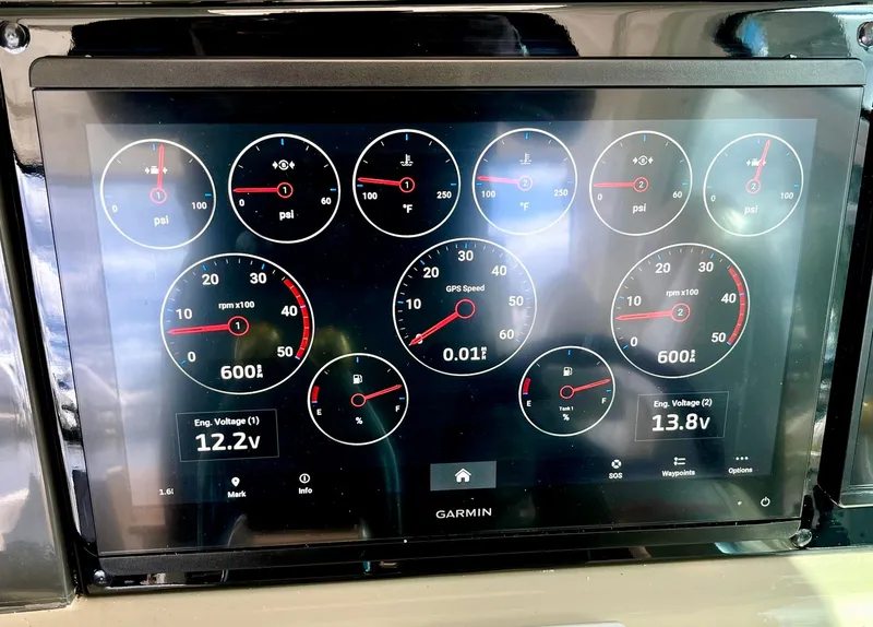 Slide: The Image of Garmin display showing engine metrics on 2006 Sea Ray 48 Sundancer yacht. - 34