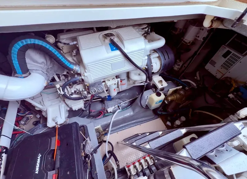 Slide: The Image of Engine compartment of a 2006 Sea Ray 48 Sundancer yacht, showcasing mechanical components. - 36