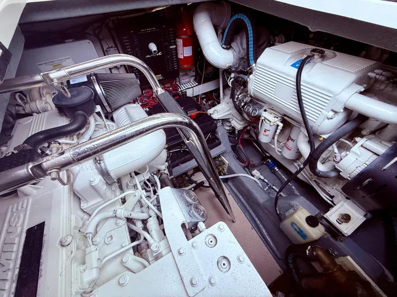 Slide: The Image of Engine room of a 2006 Sea Ray 48 Sundancer, showcasing mechanical components and systems. - 37