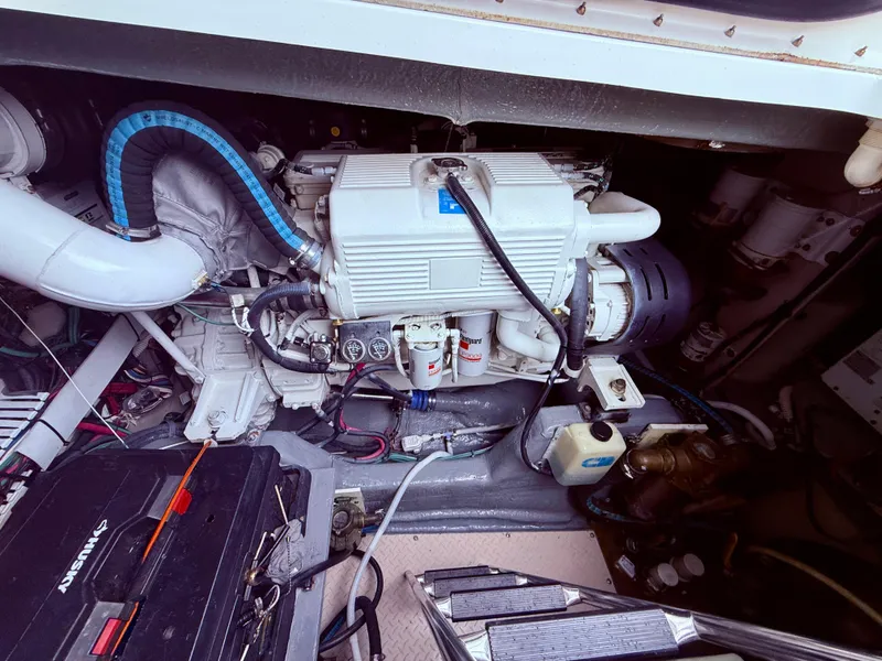 Slide: The Image of Engine compartment of a 2006 Sea Ray 48 Sundancer, showcasing mechanical components and wiring. - 40