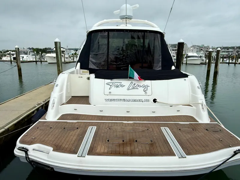 Slide: The Image of 2006 Sea Ray 48 Sundancer yacht docked at marina, rear view. - 43