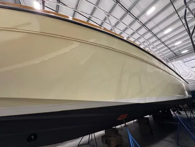 Slide: The Image of 2004 Sabre 42 Express Hardtop boat in storage, side view. - 18