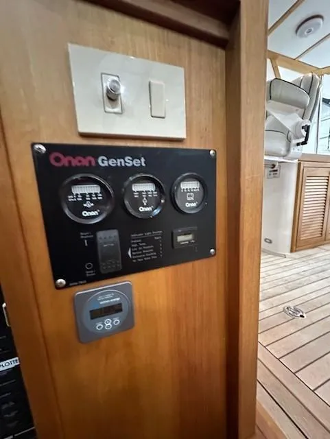 Slide: The Image of Control panel of a 2004 Sabre 42 Express Hardtop boat with Onan GenSet. - 39