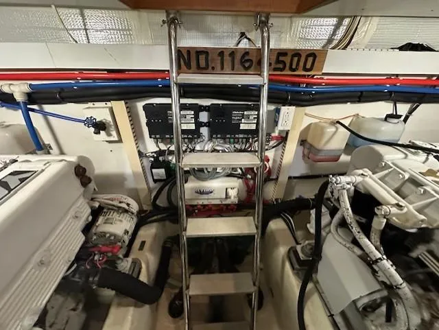 Slide: The Image of Engine room of 2004 Sabre 42 Express Hardtop with ladder and equipment. - 51