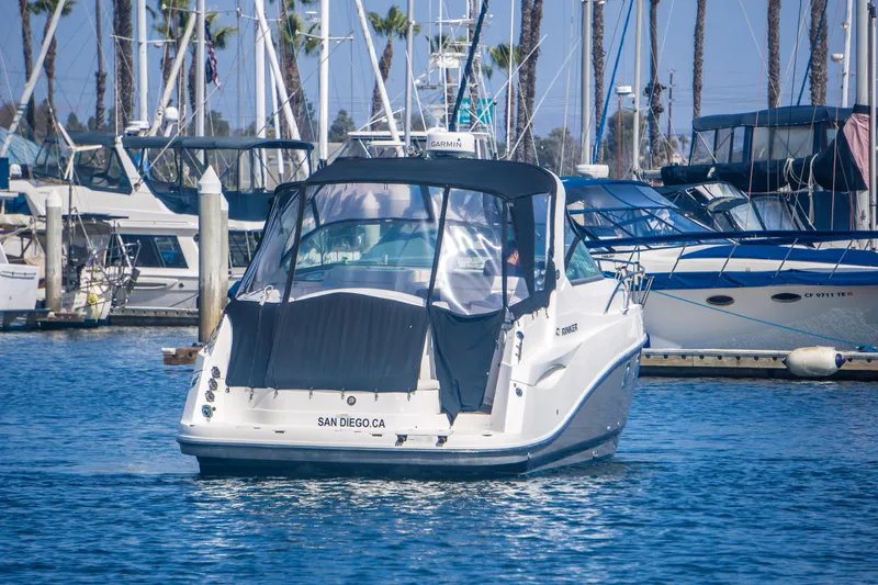 Slide: The Image of 2012 Rinker 310 Express Cruiser docked in San Diego marina. - 5