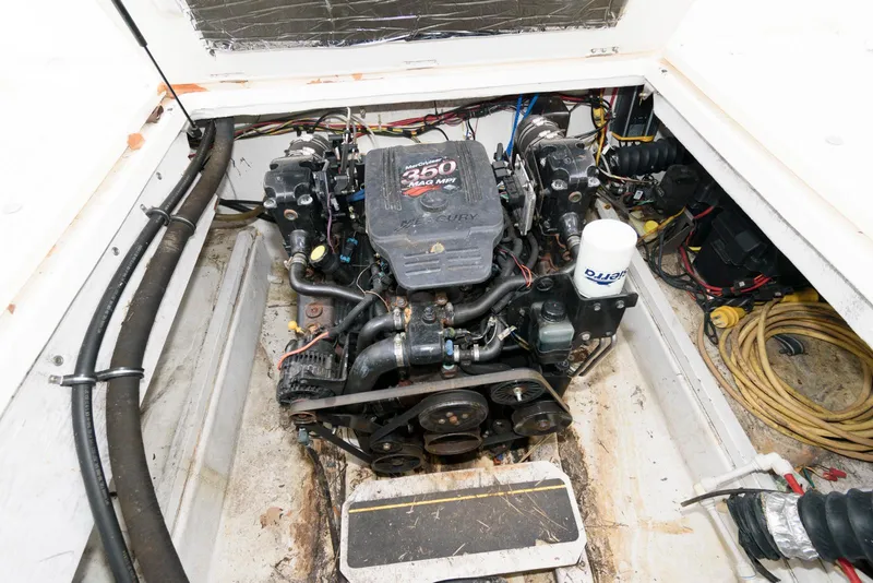 Slide: The Image of Engine compartment of a 2004 Bayliner 289 Classic boat, featuring a 250 horsepower motor. - 13