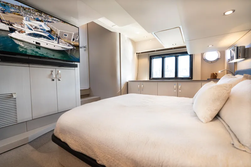 Slide: The Image of Luxurious bedroom interior of 2020 Azimut 50 Flybridge yacht with modern decor. - 15