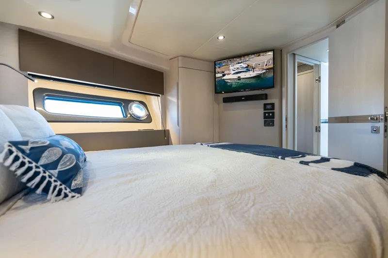 Slide: The Image of Luxurious bedroom interior of 2020 Azimut 50 Flybridge yacht with modern amenities. - 16
