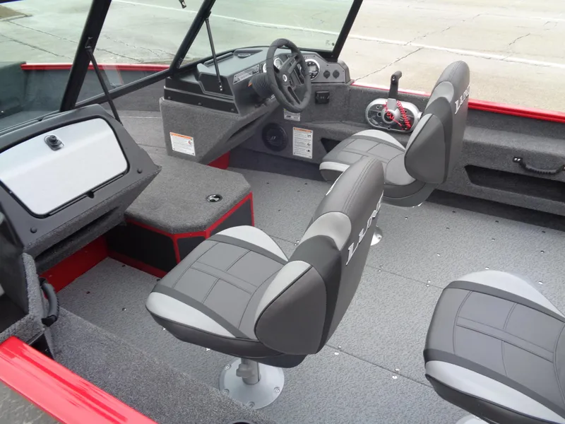 Slide: The Image of 2025 Lund 1775 Adventure Sport boat interior with modern seating and steering console. - 7