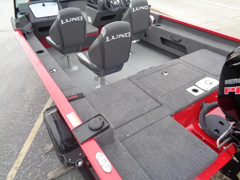 Slide: The Image of 2025 Lund 1775 Adventure Sport boat interior with seating and Mercury engine. - 8