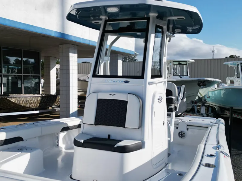 Slide: The Image of 2025 Tidewater 2500CB boat with center console, displayed outdoors under clear skies. - 11
